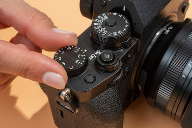 adjusting the settings in a camara using fingers