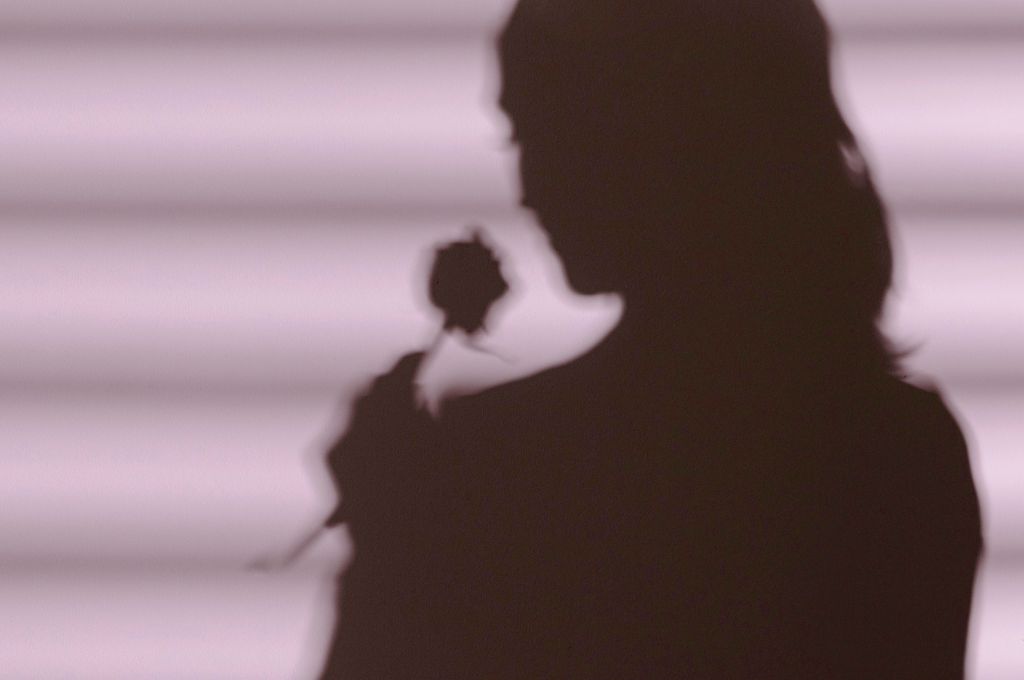 shadow of lady with flower