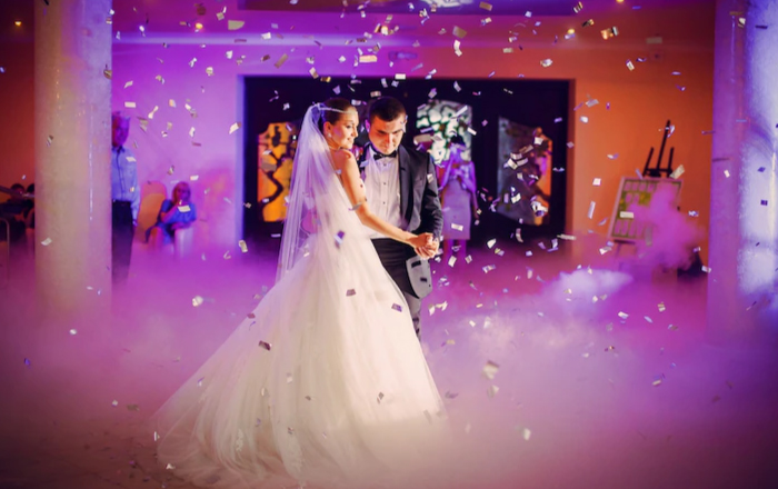 couple dancing in their wedding dress during wedding function