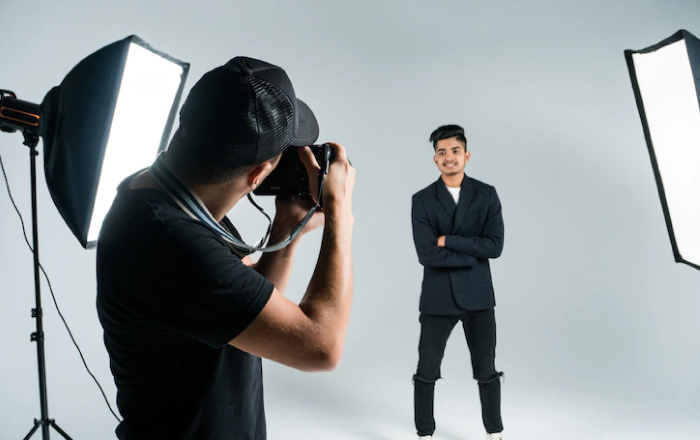 person pausing for taking photograph in a studio